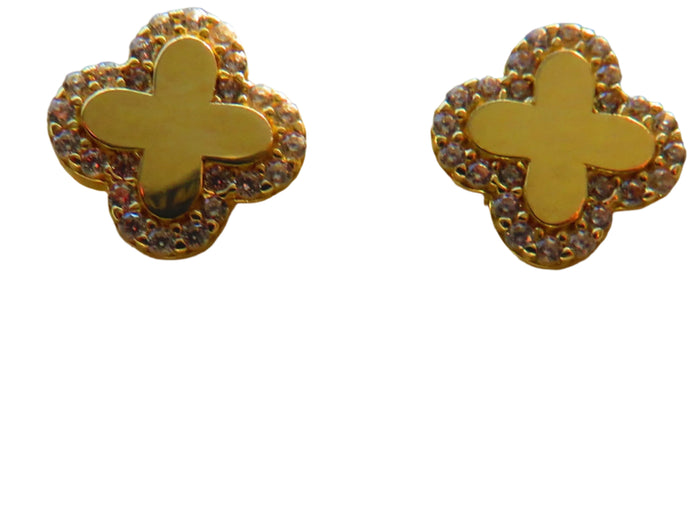 Gold butterfly earrings on a beige jewelry display box.